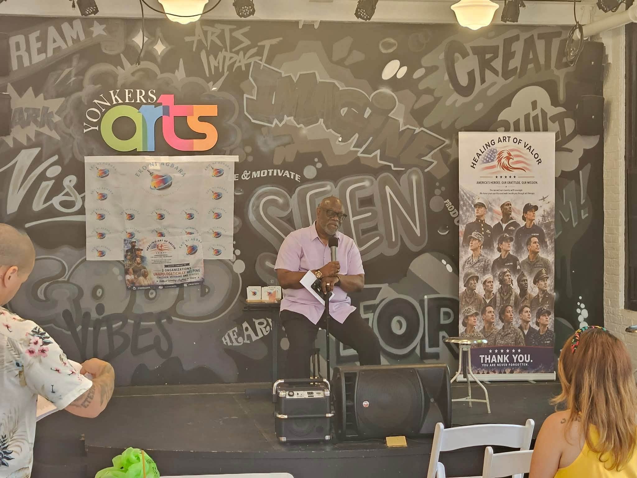 Speaker on stage at Eko ni Agbara fundraiser