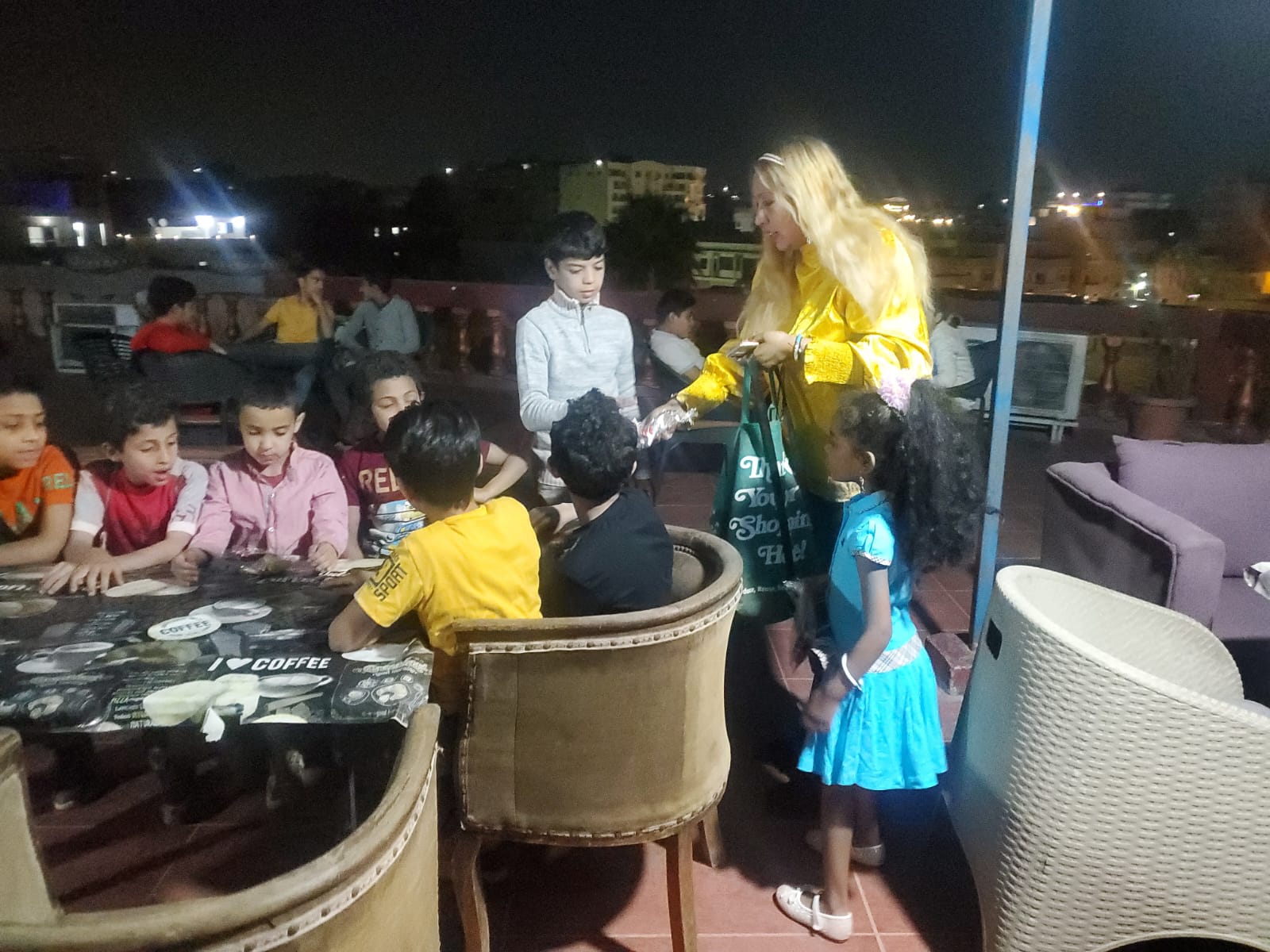 Volunteer distributing school supplies to children at a Cairo orphanage