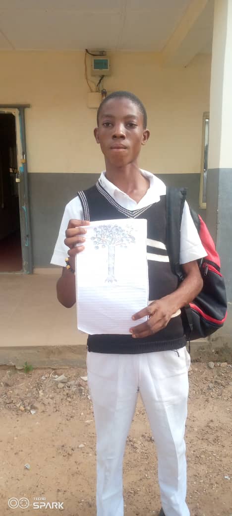 Student holding Picasso-inspired artwork — cropped to show artwork only