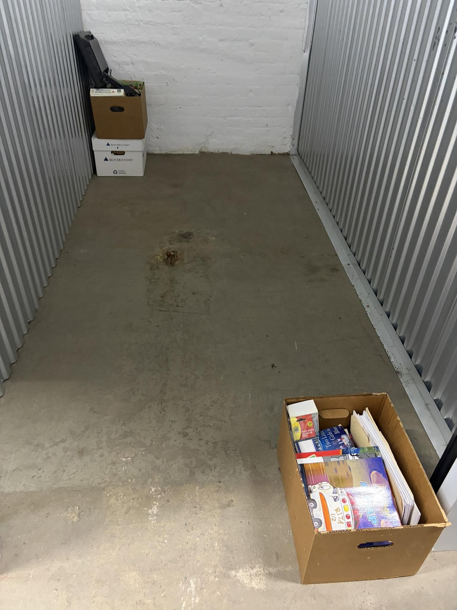 Storage unit with donated boxes of educational materials and supplies