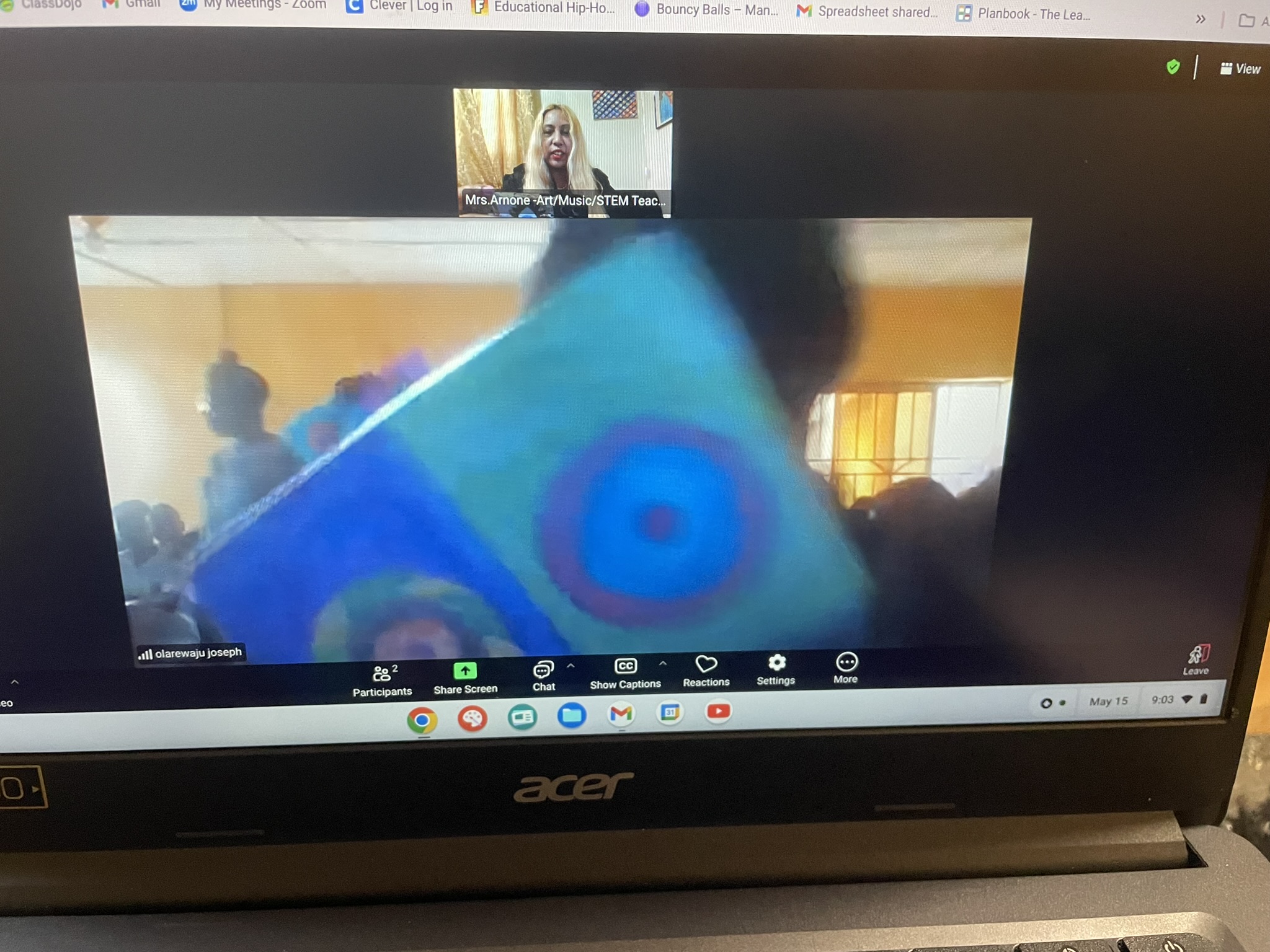 Mrs. Arnone teaching virtual art class via Zoom to students in Nigeria